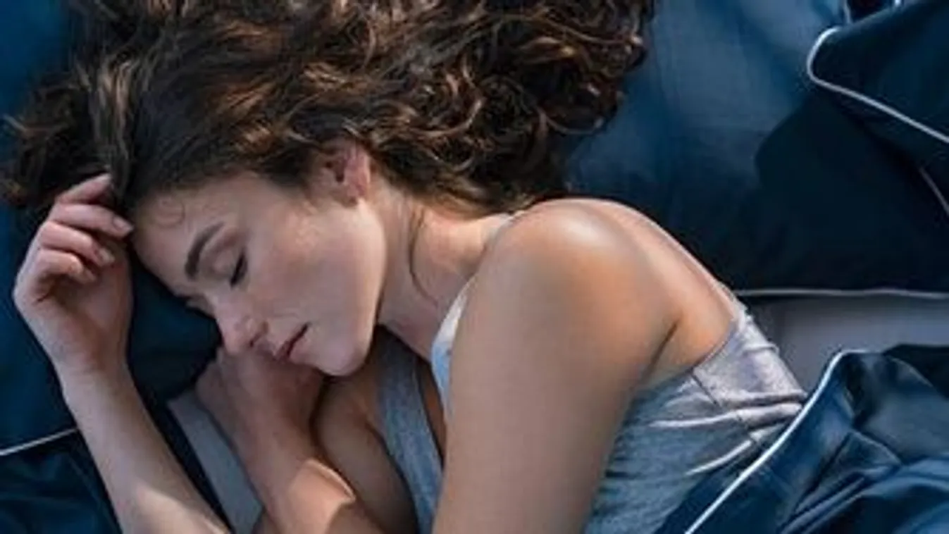 Top,View,Of,Young,Woman,Sleeping,On,Side,In,Her