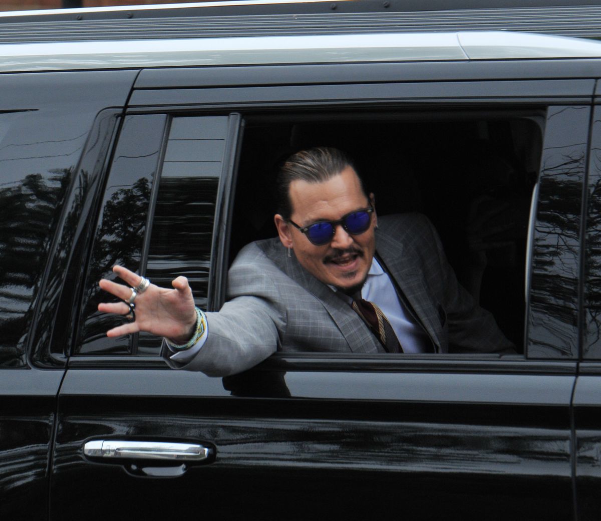 Johnny Depp Appears in Good Spirits as He Exits The Courthouse in Fairfax, Virginia.
