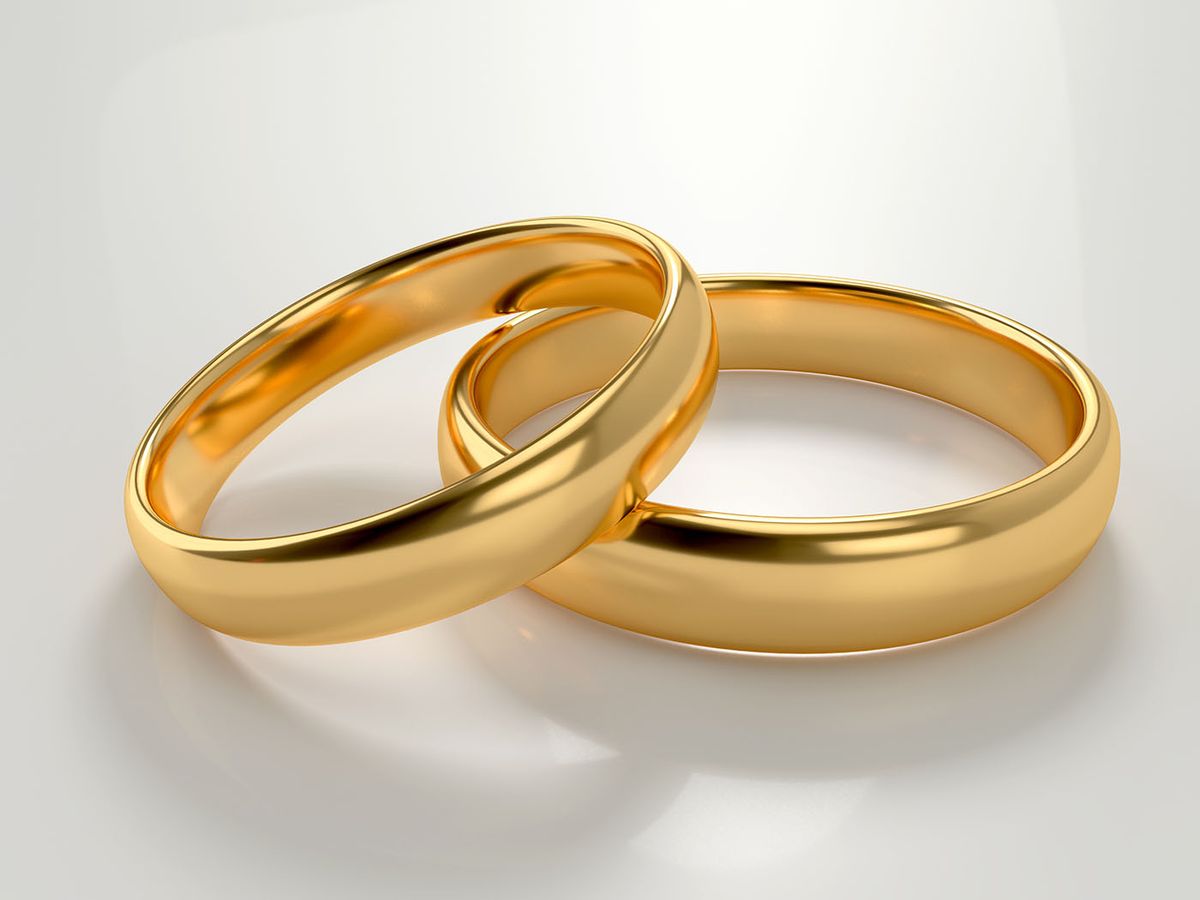 Illustration,Of,Two,Wedding,Gold,Rings,Lie,In,Each,Other