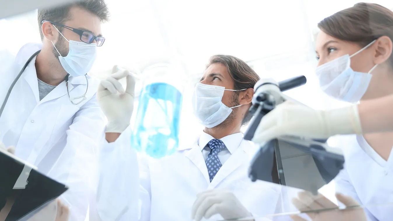 Young,Scientists,Working,With,A,Microscope,And,Test,Tubes