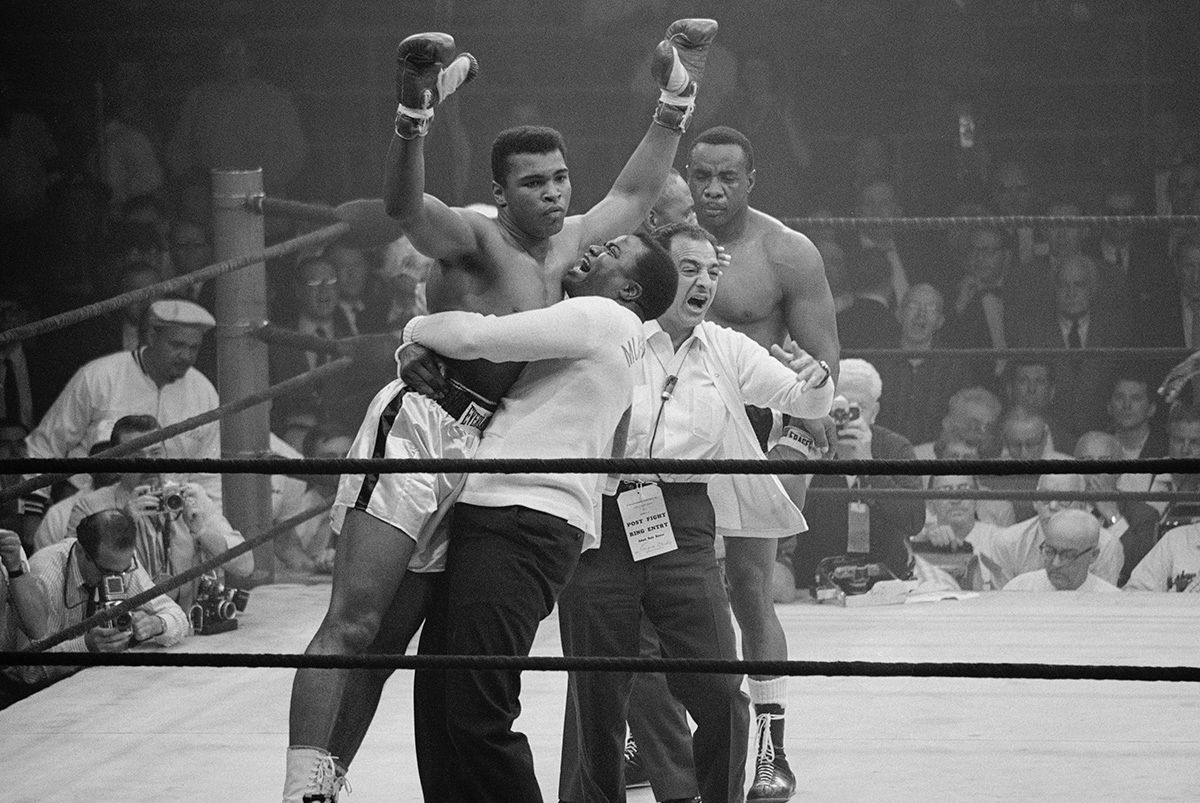 Boxer Muhammad Ali Defeating Sonny Liston