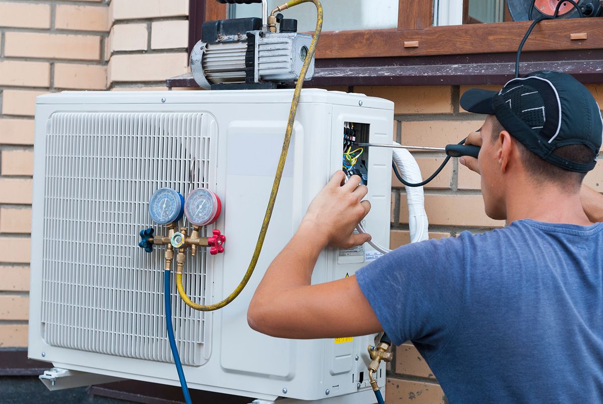 The,Worker,Installs,The,Outdoor,Unit,Of,The,Air,Conditioner