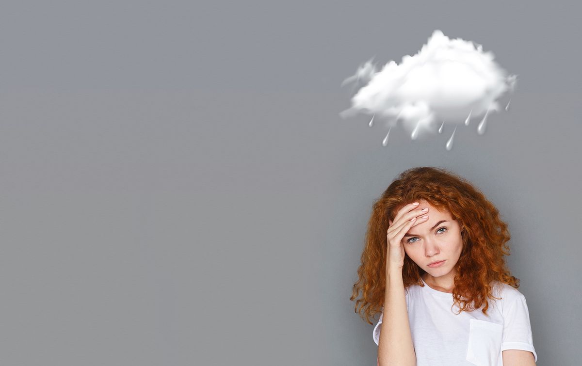 Bad,Weather,Concept.,Redhaired,Girl,Holding,Her,Head,With,Hand