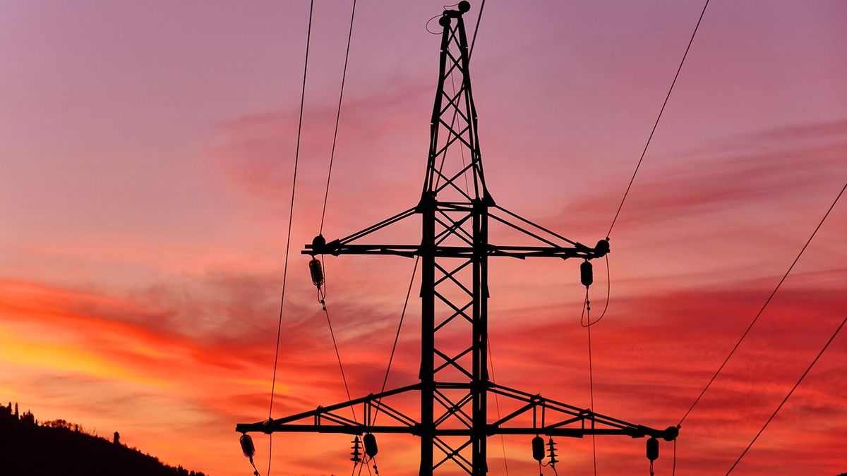 Power,Line,Support,In,The,Mountains,At,Sunset