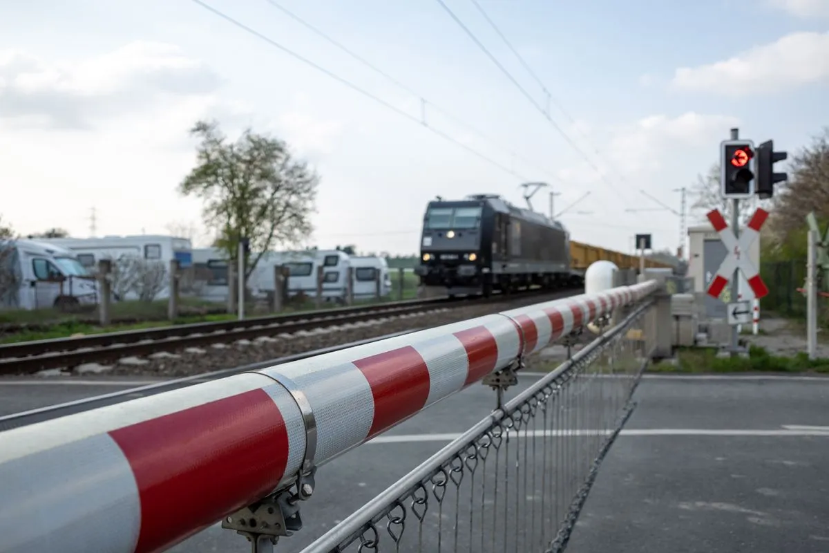 Selective,Focus,View,At,Red,And,White,Level,Crossing,Railway