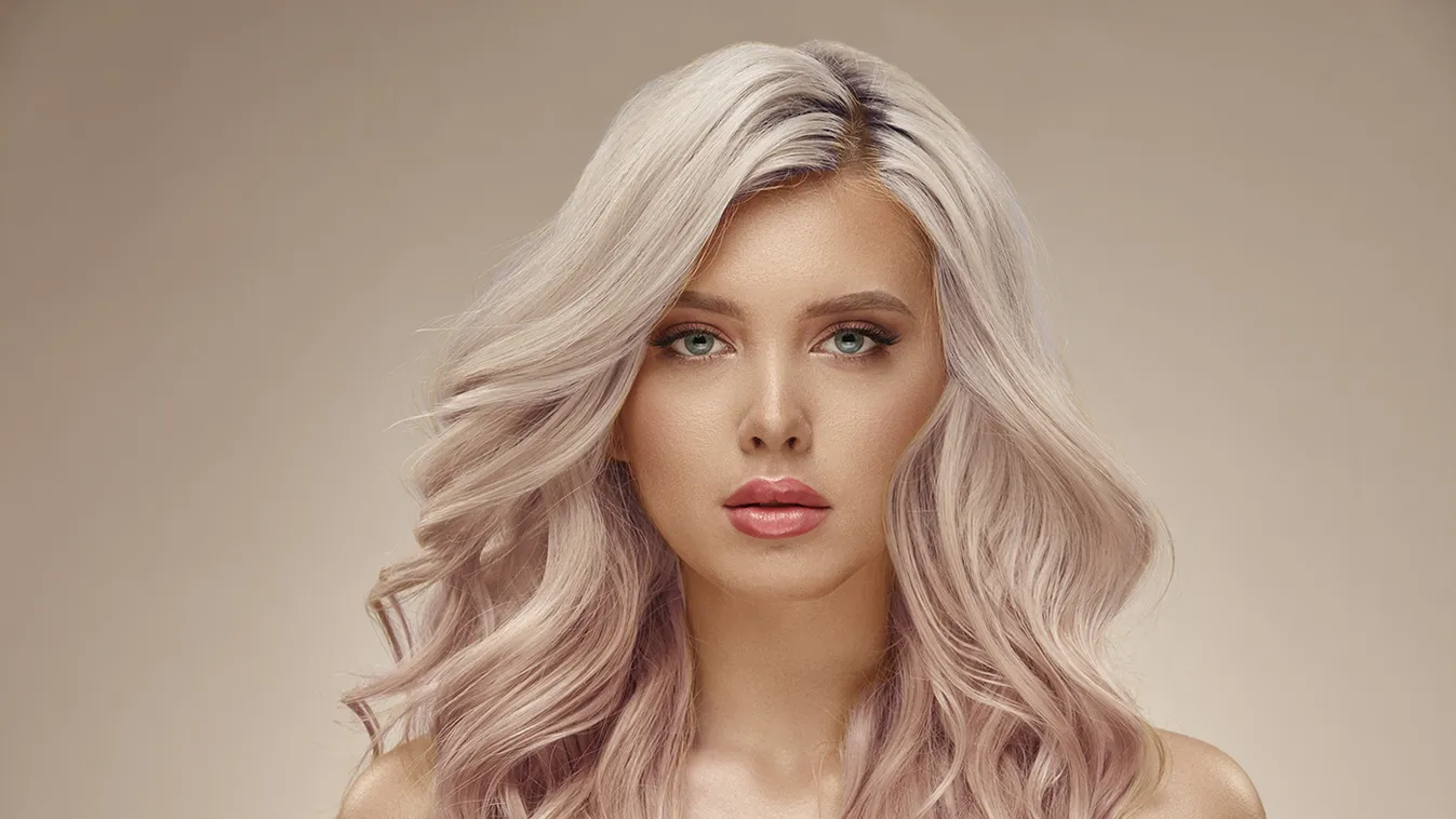 Gorgeous,Woman,With,Beautiful,Wavy,Pink,Hair,On,A,Beige