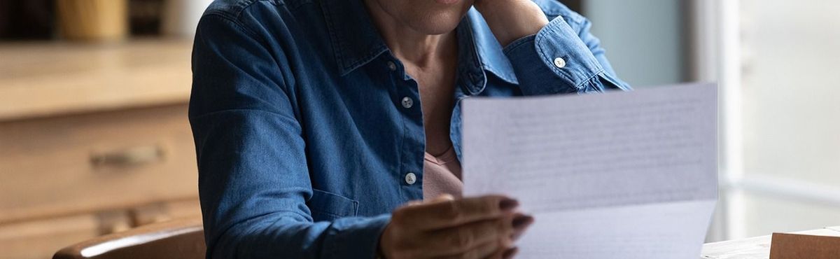 Unhappy,Mature,Caucasian,60s,Woman,In,Glasses,Read,Post,Paper