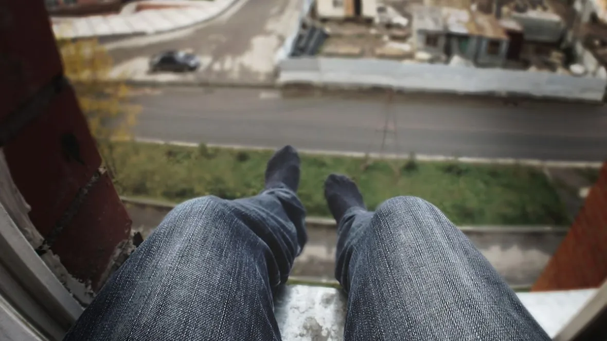 A,Man,With,Depression,Sits,On,The,Window,,Wants,To