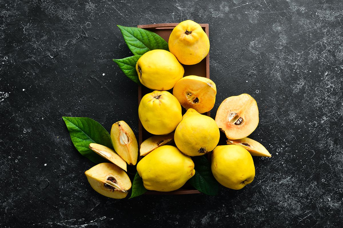 Fresh,Ripe,Yellow,Quince.,Fruits,In,A,Wooden,Box.,Top