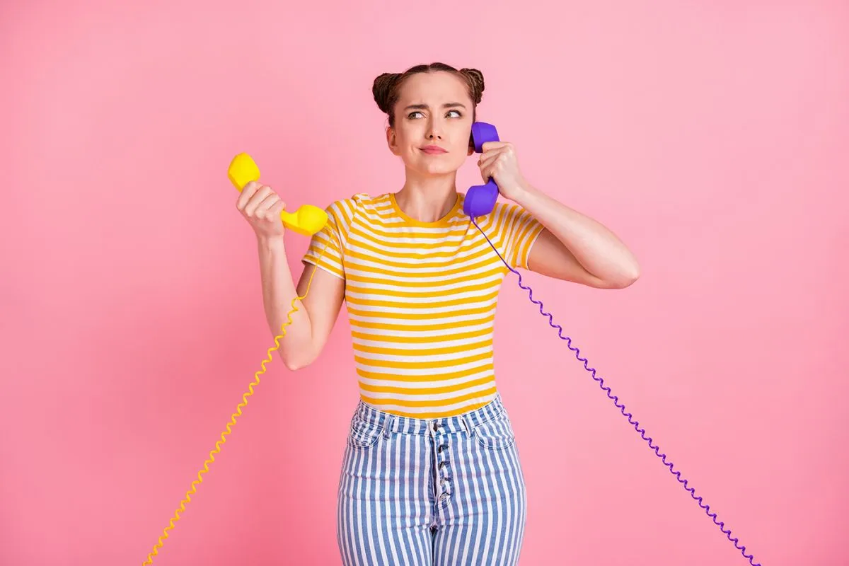 Portrait,Of,Pretty,Person,Arms,Hold,Two,Vintage,Handset,Doubtful