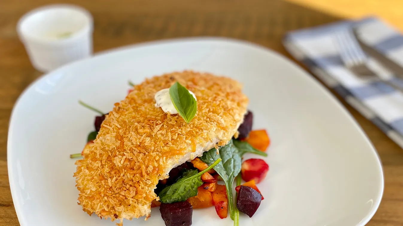 Crumbed,Chicken,On,A,Bed,Of,Roasted,Vegetable