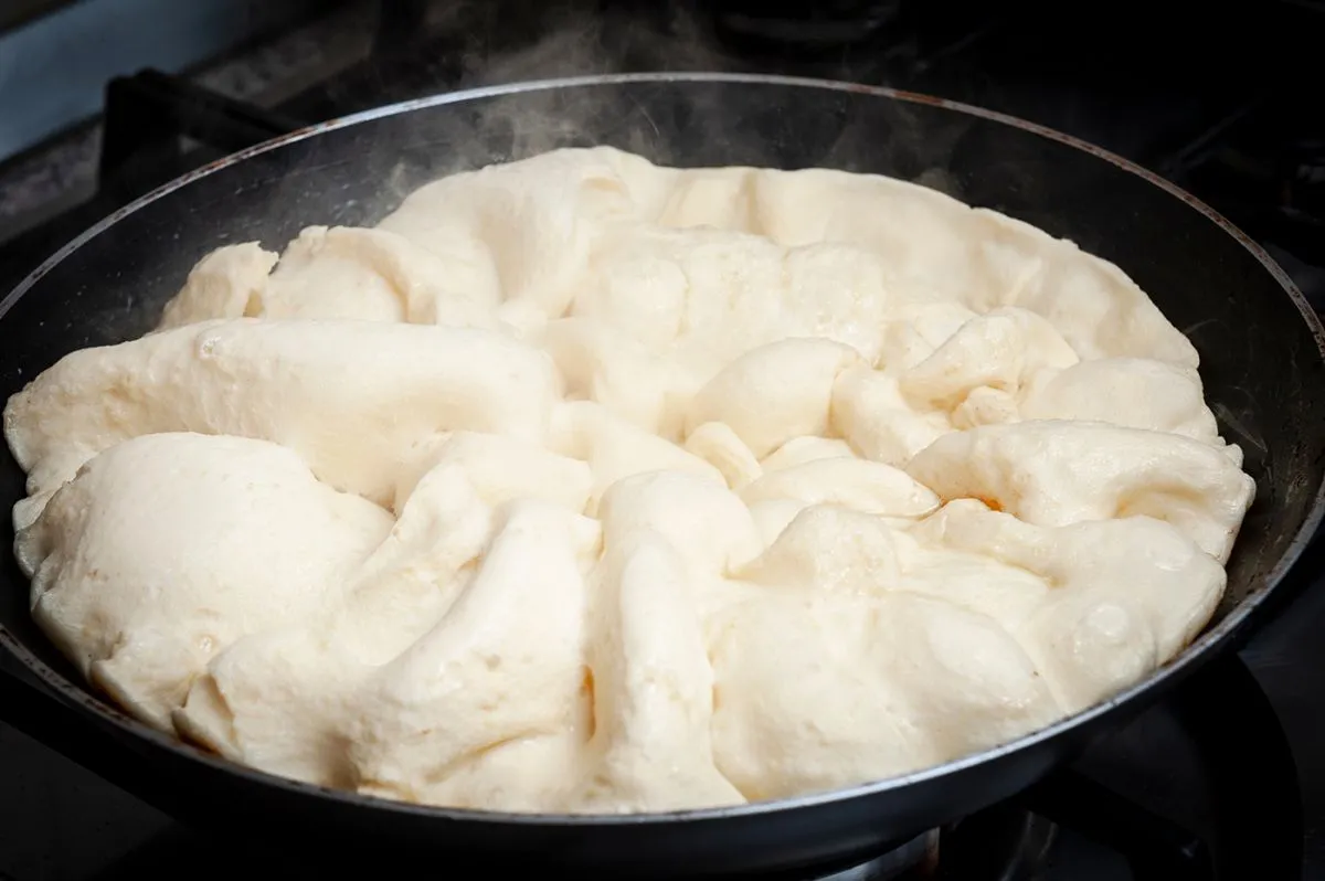 Raw,Dough,Of,Kaiserschmarrn,During,Cooking,In,A,Metal,Pan