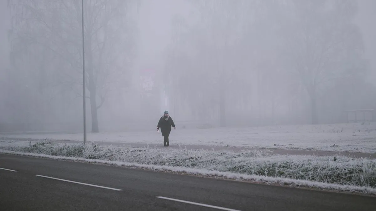 Riga,,Latvia-november,15,,2021:,Young,Woman,In,A,Black,Coat