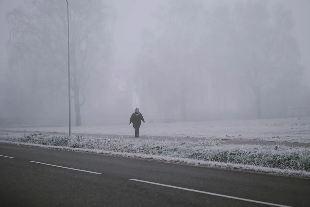Riga,,Latvia-november,15,,2021:,Young,Woman,In,A,Black,Coat