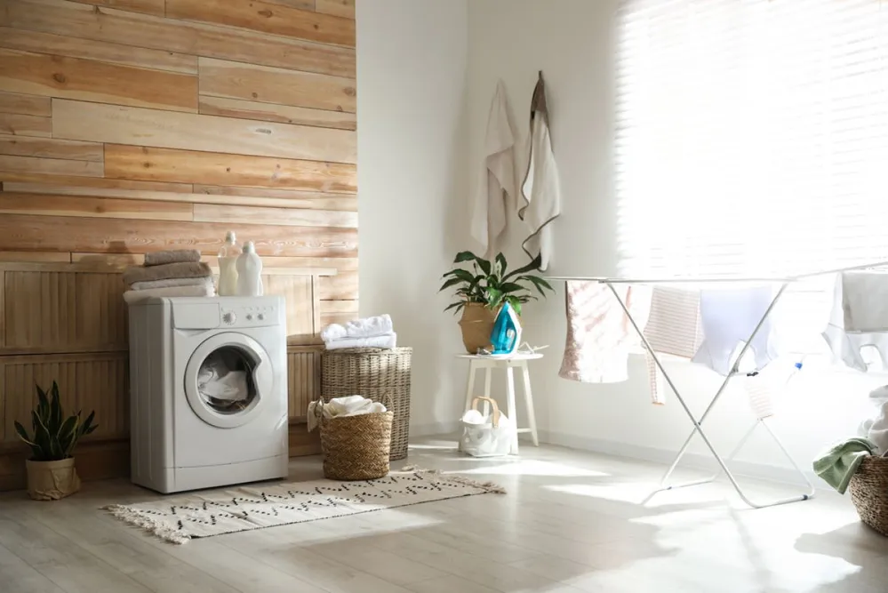 Stylish,Room,Interior,With,Modern,Washing,Machine,And,Drying,Rack