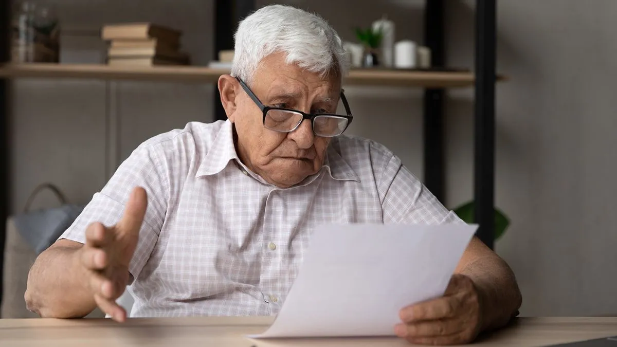 Confused,Frustrated,Elder,Senior,80s,Man,In,Glasses,Reading,Document