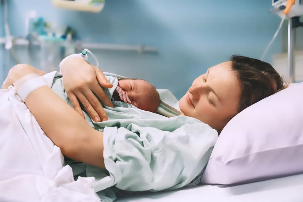 Mother,And,Newborn.,Child,Birth,In,Maternity,Hospital.,Young,Mom