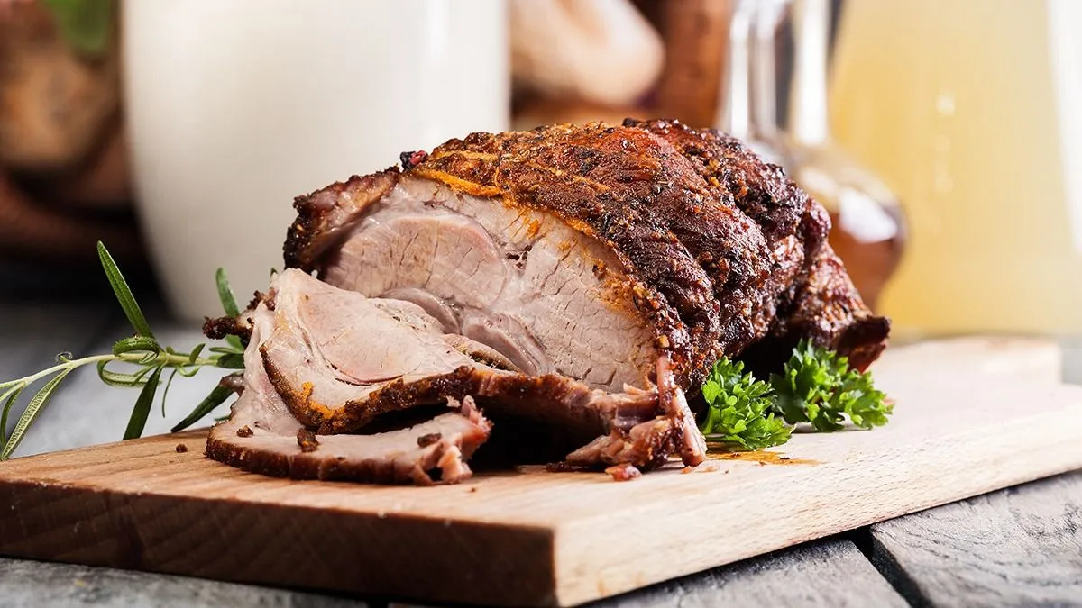 Roasted,Shoulder,Of,Pork,On,A,Cutting,Board