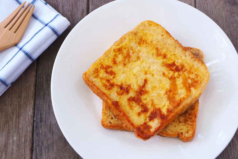 Close,Up,Of,French,Toast,On,A,Wooden,Table.