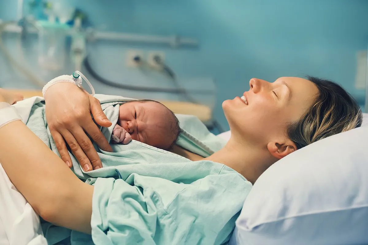 Mother,And,Newborn.,Child,Birth,In,Maternity,Hospital.,Young,Mom