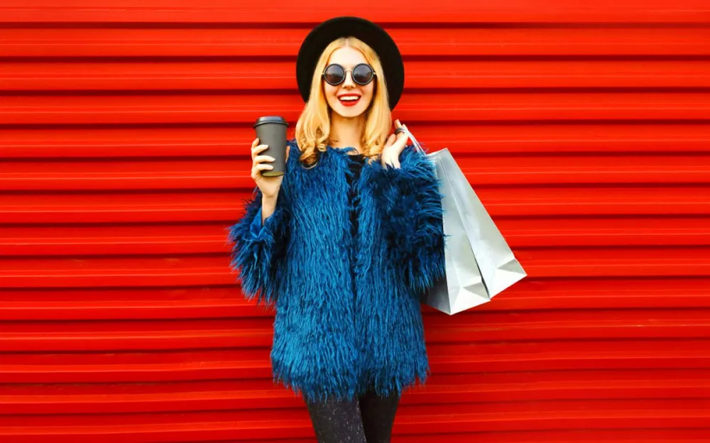 Portrait,Stylish,Smiling,Woman,With,Coffee,Cup,And,Shopping,Bags
