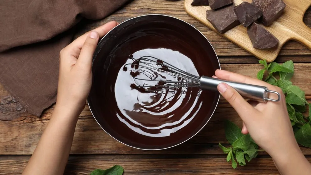 Woman,Making,Delicious,Chocolate,Cream,At,Wooden,Table,,Top,View