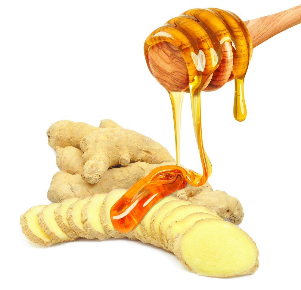 Honey,Dripping,On,Ginger,Root,Isolated,On,White,Background