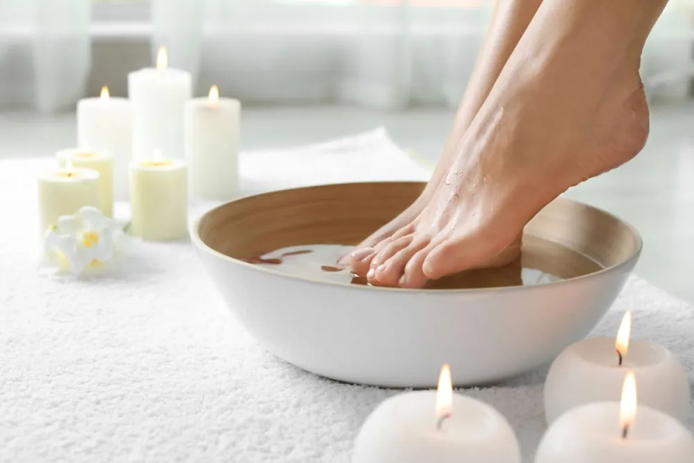 Woman,Soaking,Her,Feet,In,Dish,Indoors,,Closeup,With,Space