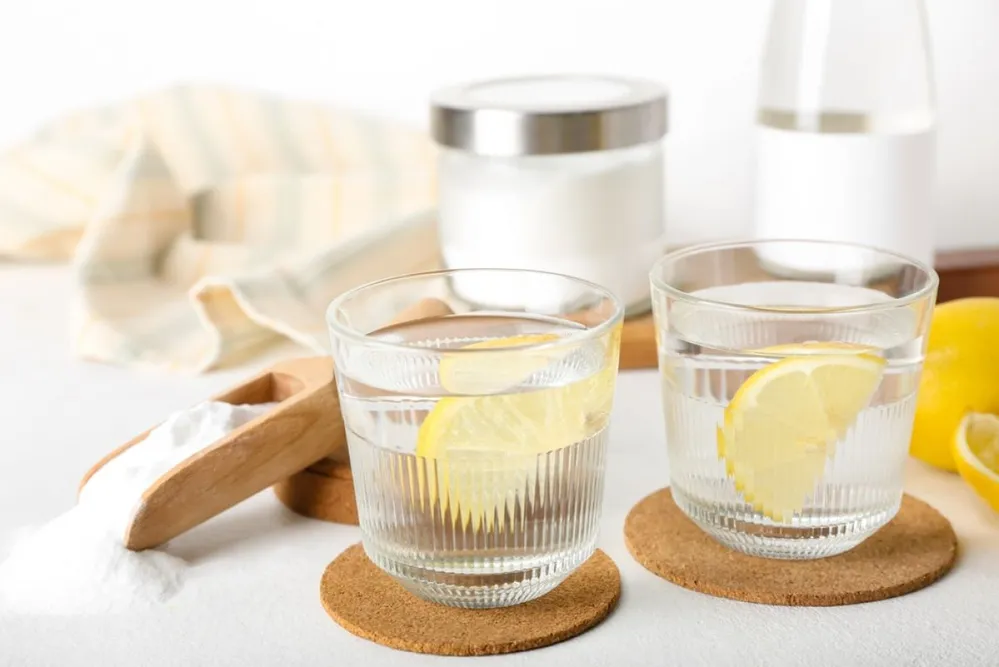 Glasses,Of,Water,With,Lemon,Slices,And,Baking,Soda,On