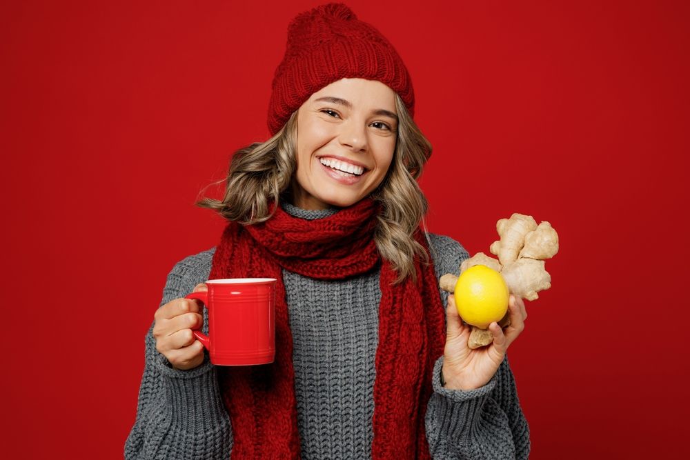 Young,Happy,Woman,Wear,Grey,Sweater,Scarf,Hat,Hold,Show