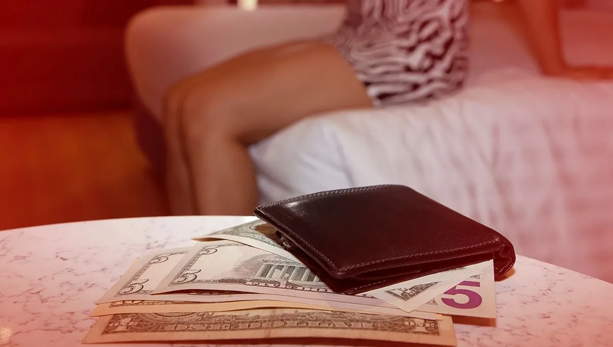 Selective,Focus,Of,Black,Purse,With,A,Money,Which,Escort