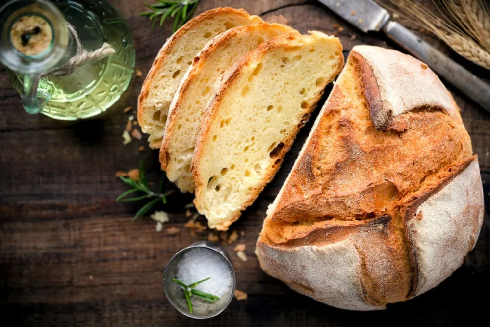 Rustic,Loaf,Of,Homemade,Bread,Served,With,Olive,Oil,,Rosemary