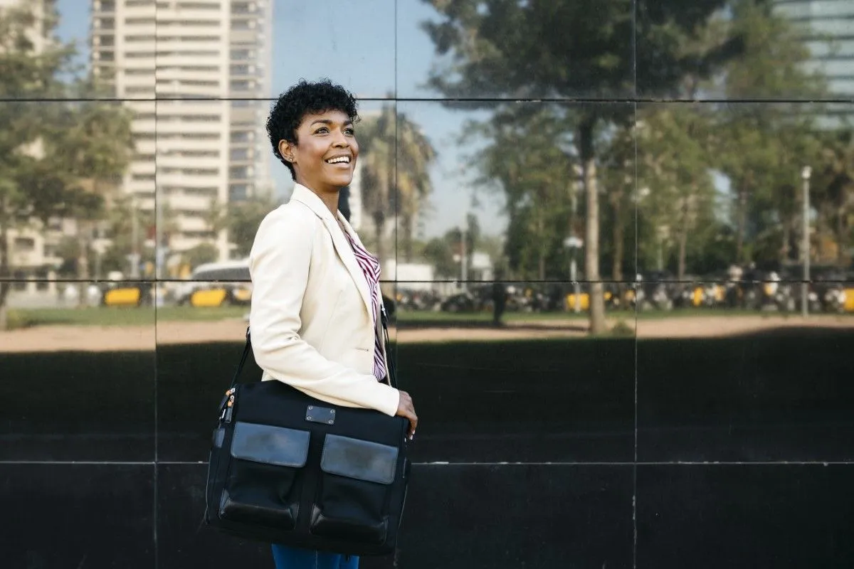 Woman with laptop bag walking