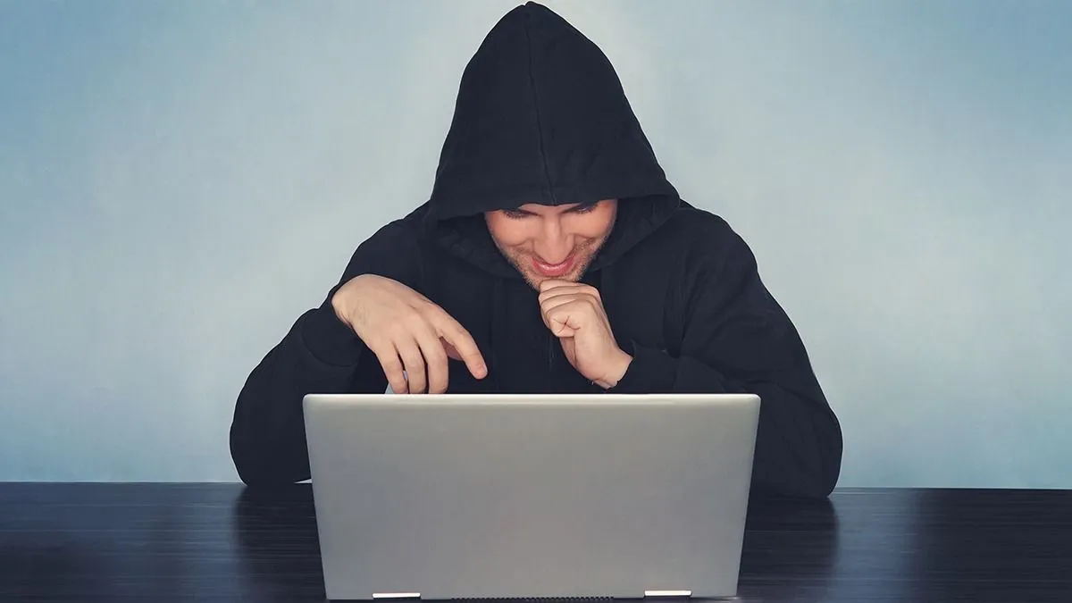 Glad,Hacker,In,A,Black,Hood,Picks,Up,The,Password.