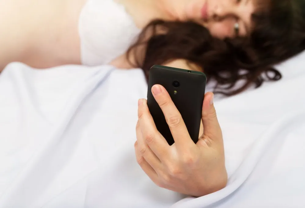 Beautiful,Young,Woman,In,White,Lingerie,Lying,In,Bed,And