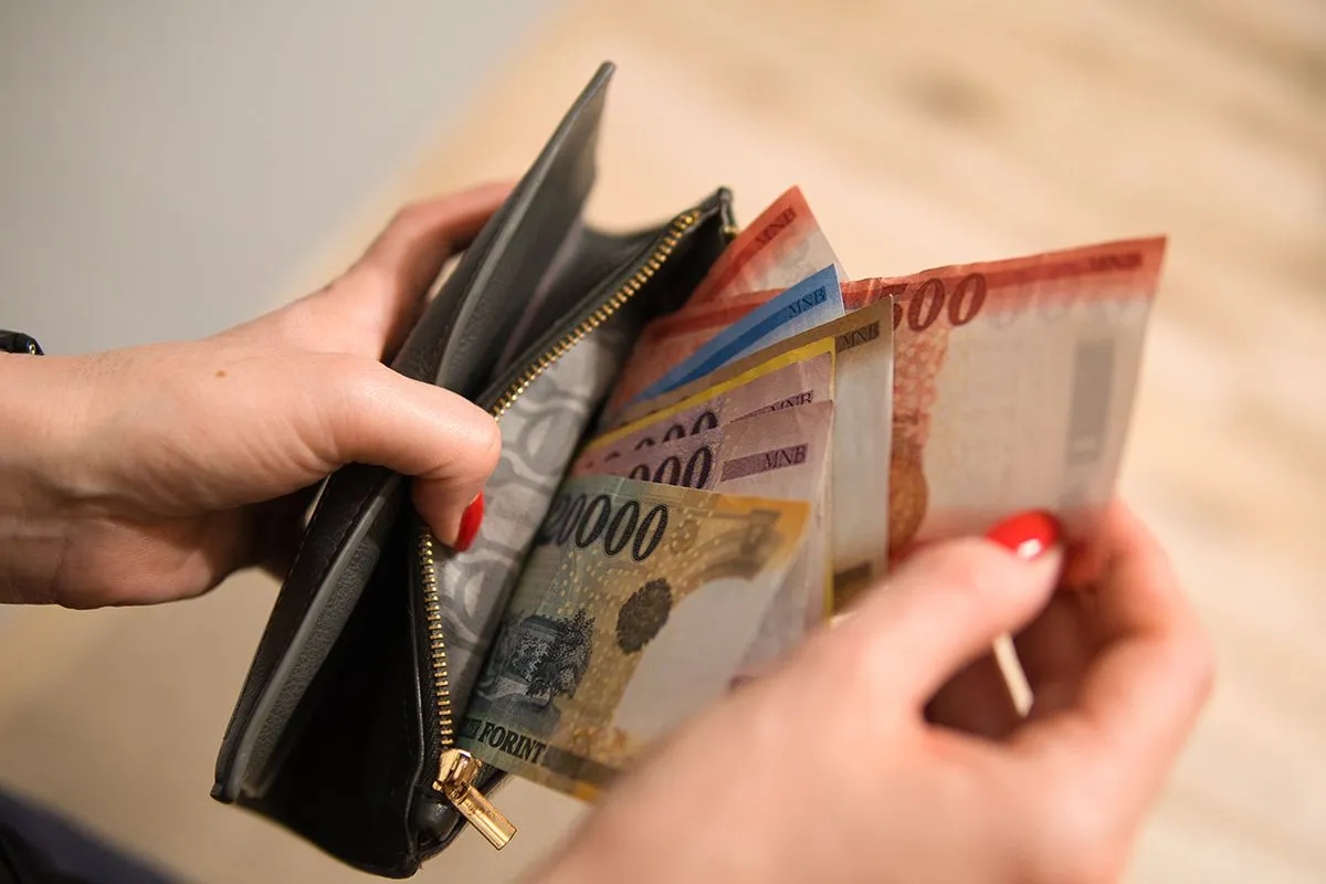 A,Woman,Puts,Hungarian,Forints,In,Her,Wallet.,The,Woman
