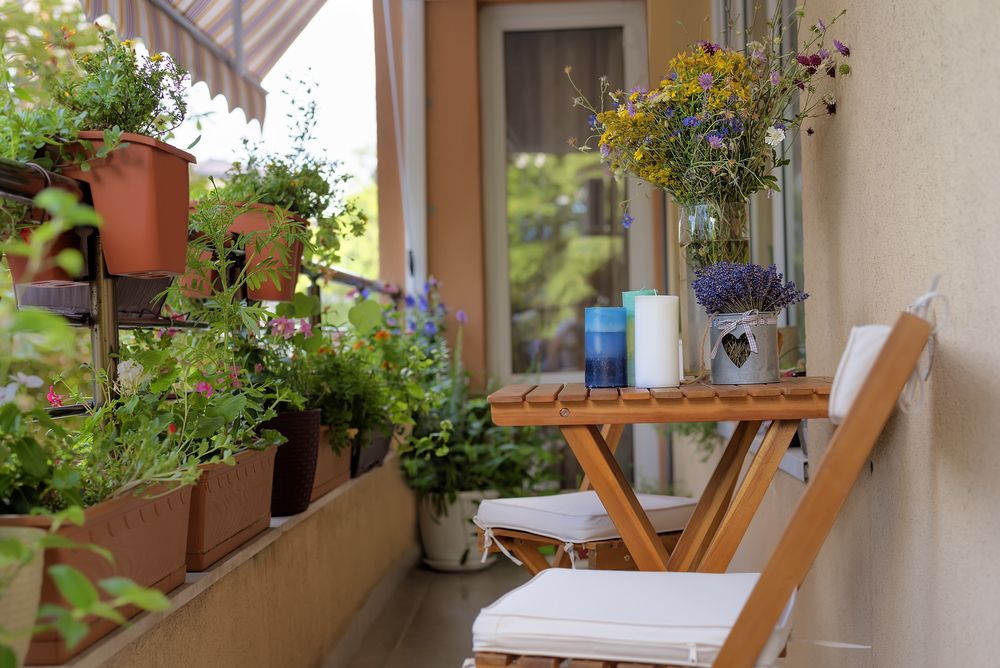 Urban,Terrace,With,Flowers.,Table,With,A,Bouquet,Of,Wildflowers,