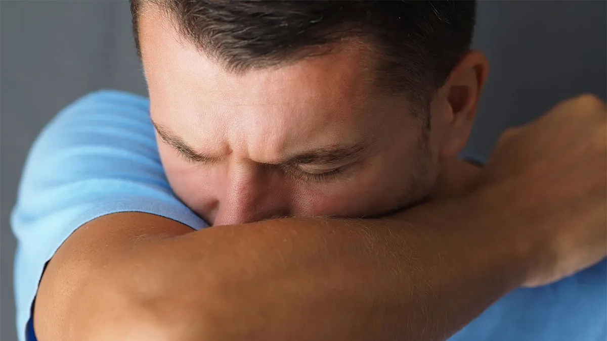 Close-up.,Caucasian,Male,Coughs,In,His,Elbow.,Correct,Sneezing.,Concept