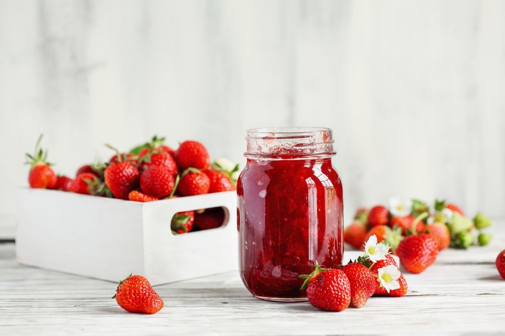 Homemade,Strawberry,Preserves,Or,Jam,In,A,Mason,Jar,Surrounded