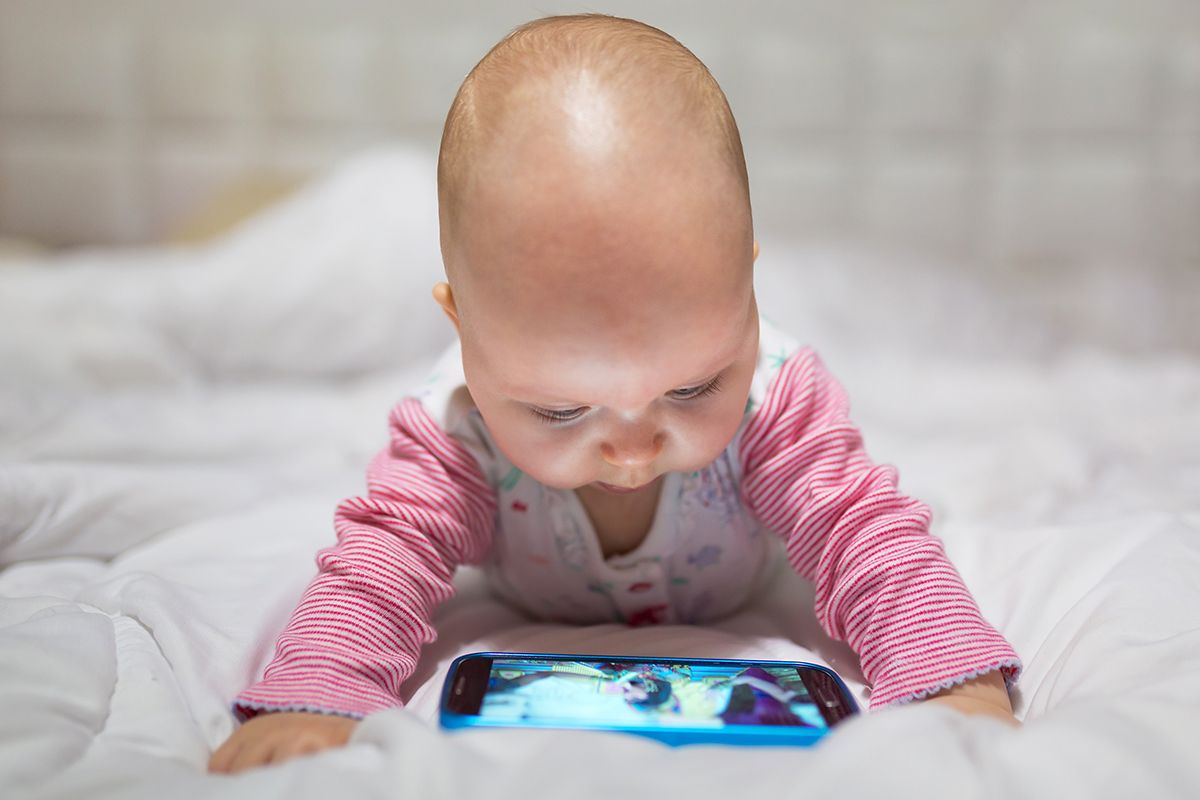 Baby,Girl,Watching,Cartoon,On,The,Mobile,Phone