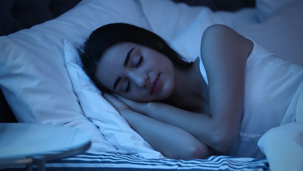Young,Woman,Sleeping,In,Bed,At,Night.,Sleeping,Time