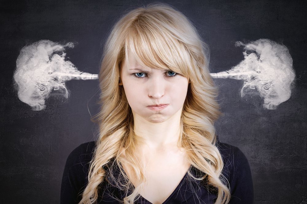 Closeup,Portrait,Of,Angry,Young,Woman,,Blowing,Steam,Coming,Out