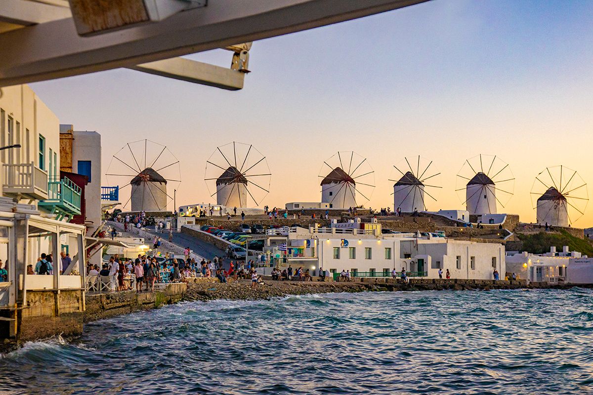 Iconic Windmills In Mykonos Island During The Sunset