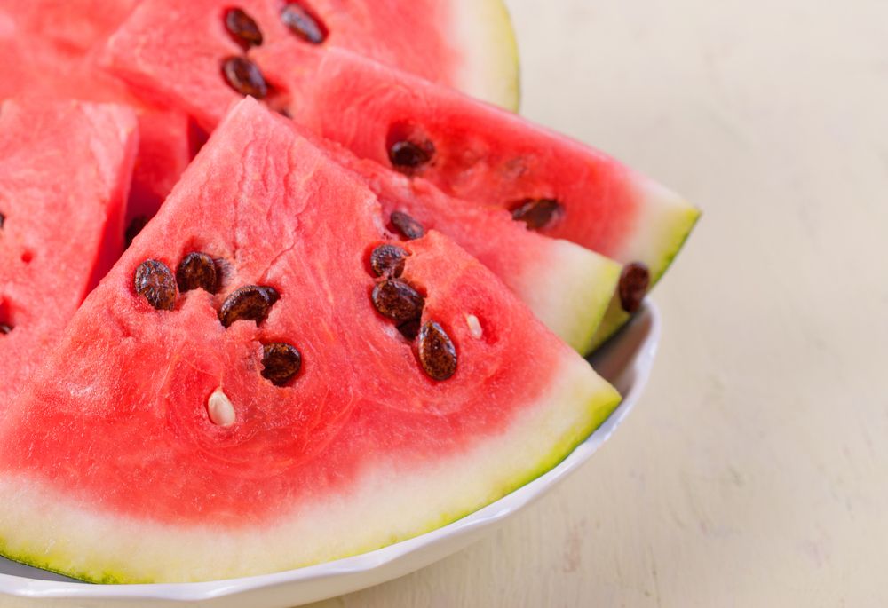 Chunks,Of,Watermelon,With,Big,Seeds,Lying,On,A,Plate