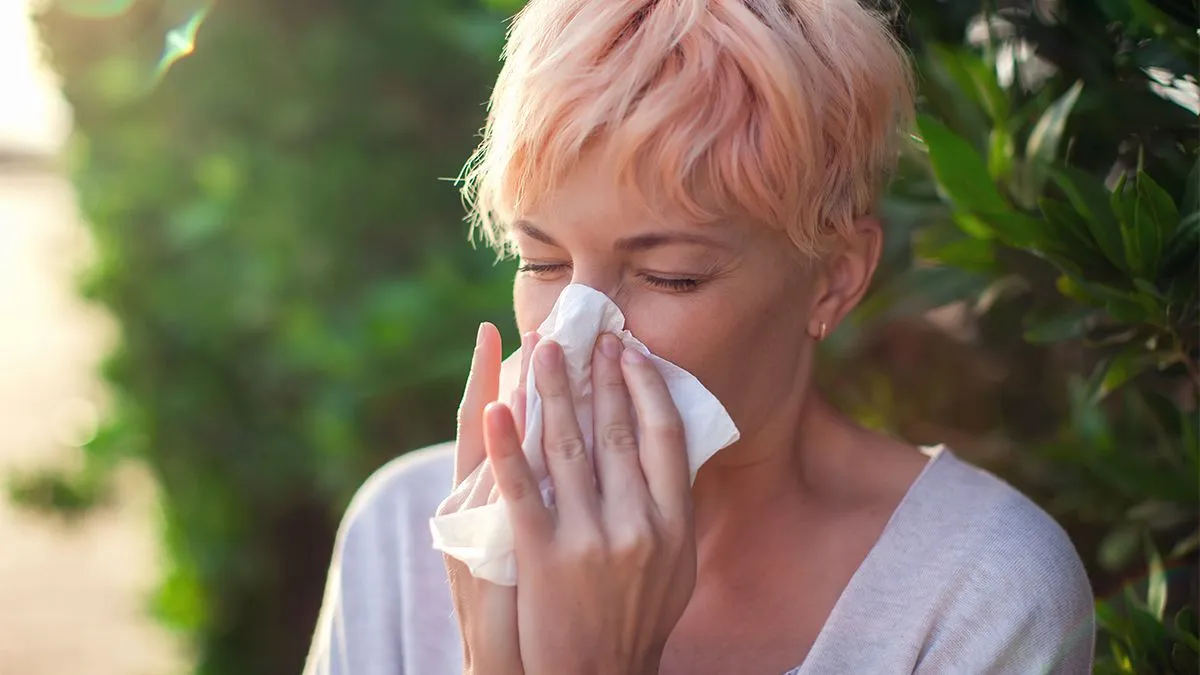 Young,Woman,With,Short,Hair,Sneezing,Into,Tissue.,Flu,,Allergy,