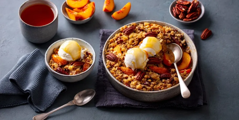 Crumble,With,Ice,Cream,In,Bowl.,Grey,Background.,Close,Up.