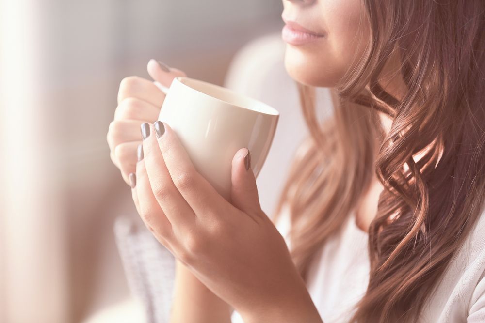 Beautiful,Young,Woman,With,Cup,Of,Coffee,At,Home