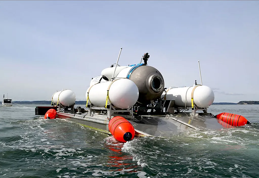 This undated image courtesy of OceanGate Expeditions, shows their Titan submersible being towed to a dive location in Everett, Washington. Rescue teams expanded their search underwater on June 20, 2023, as they raced against time to find a Titan deep-diving tourist submersible that went missing near the wreck of the Titanic with five people on board and limited oxygen. All communication was lost with the 21-foot (6.5-meter) Titan craft during a descent June 18 to the Titanic, which sits at a depth of crushing pressure more than two miles (nearly four kilometers) below the surface of the North Atlantic. (Photo by Handout / OceanGate Expeditions / AFP) / RESTRICTED TO EDITORIAL USE - MANDATORY CREDIT "AFP PHOTO / OceanGate Expeditions" - NO MARKETING NO ADVERTISING CAMPAIGNS - DISTRIBUTED AS A SERVICE TO CLIENTS