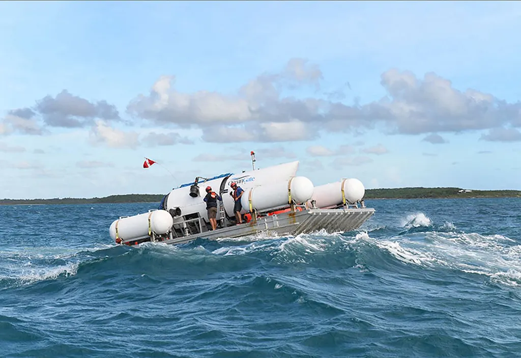 This undated image courtesy of OceanGate Expeditions, shows their Titan submersible being towed to a dive location. Rescue teams expanded their search underwater on June 20, 2023, as they raced against time to find a Titan deep-diving tourist submersible that went missing near the wreck of the Titanic with five people on board and limited oxygen. All communication was lost with the 21-foot (6.5-meter) Titan craft during a descent June 18 to the Titanic, which sits at a depth of crushing pressure more than two miles (nearly four kilometers) below the surface of the North Atlantic. (Photo by Handout / OceanGate Expeditions / AFP) / RESTRICTED TO EDITORIAL USE - MANDATORY CREDIT "AFP PHOTO / OceanGate Expeditions" - NO MARKETING NO ADVERTISING CAMPAIGNS - DISTRIBUTED AS A SERVICE TO CLIENTS