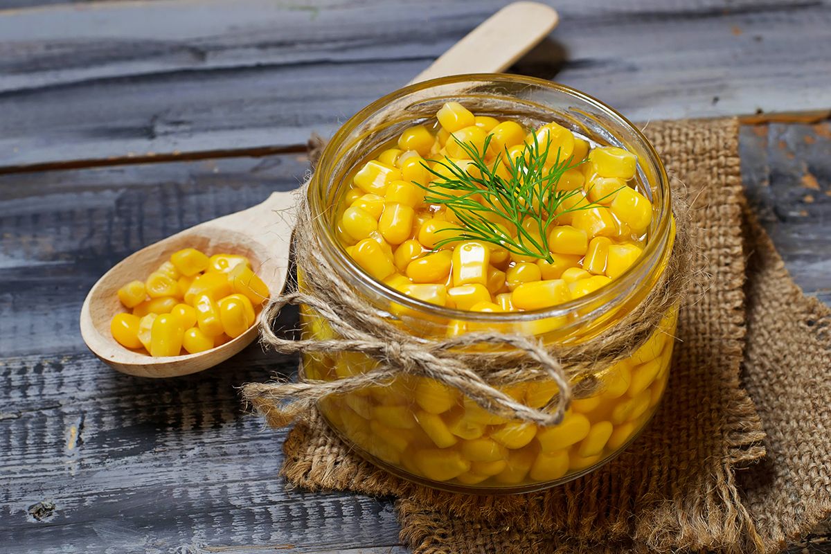 Canned,Sweet,Corn,In,Wooden,Background.,Selective,Focus